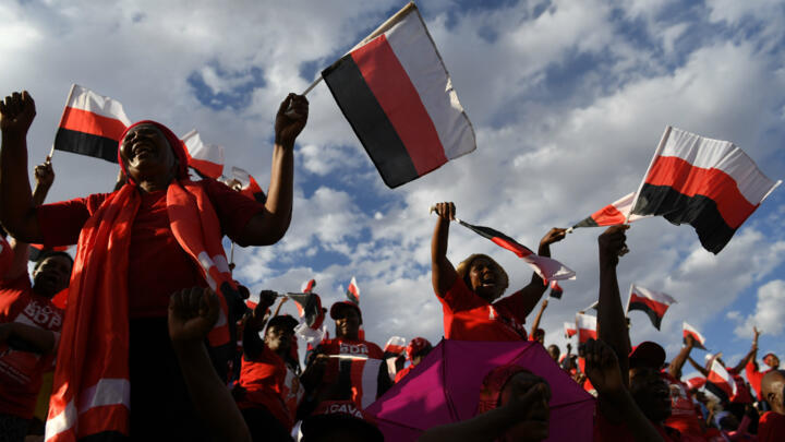 Botswana Democratic Party (BDP) supporters gesture during an election campaign rally. Botswana will have their general election on October 23, 2019.